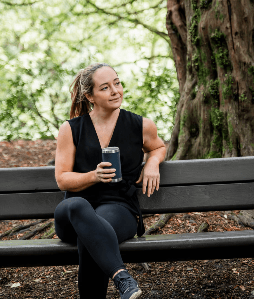 Diane Lillis, personal trainer from Move With Diane, taking a break on a bench