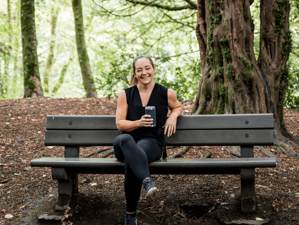 Diane Lillis, personal trainer from Move With Diane, having a coffee break on a bench