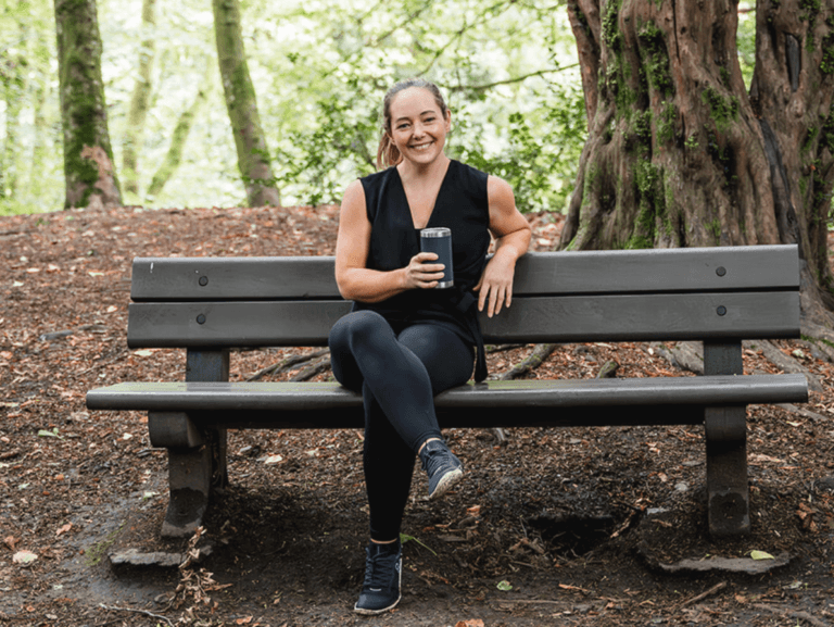 Diane Lillis, personal trainer from Move With Diane, having a coffee break on a bench