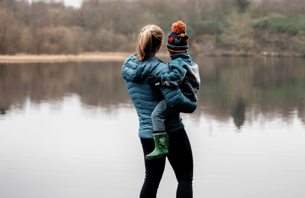 Diane Lillis, personal trainer from Move With Diane, holding her son