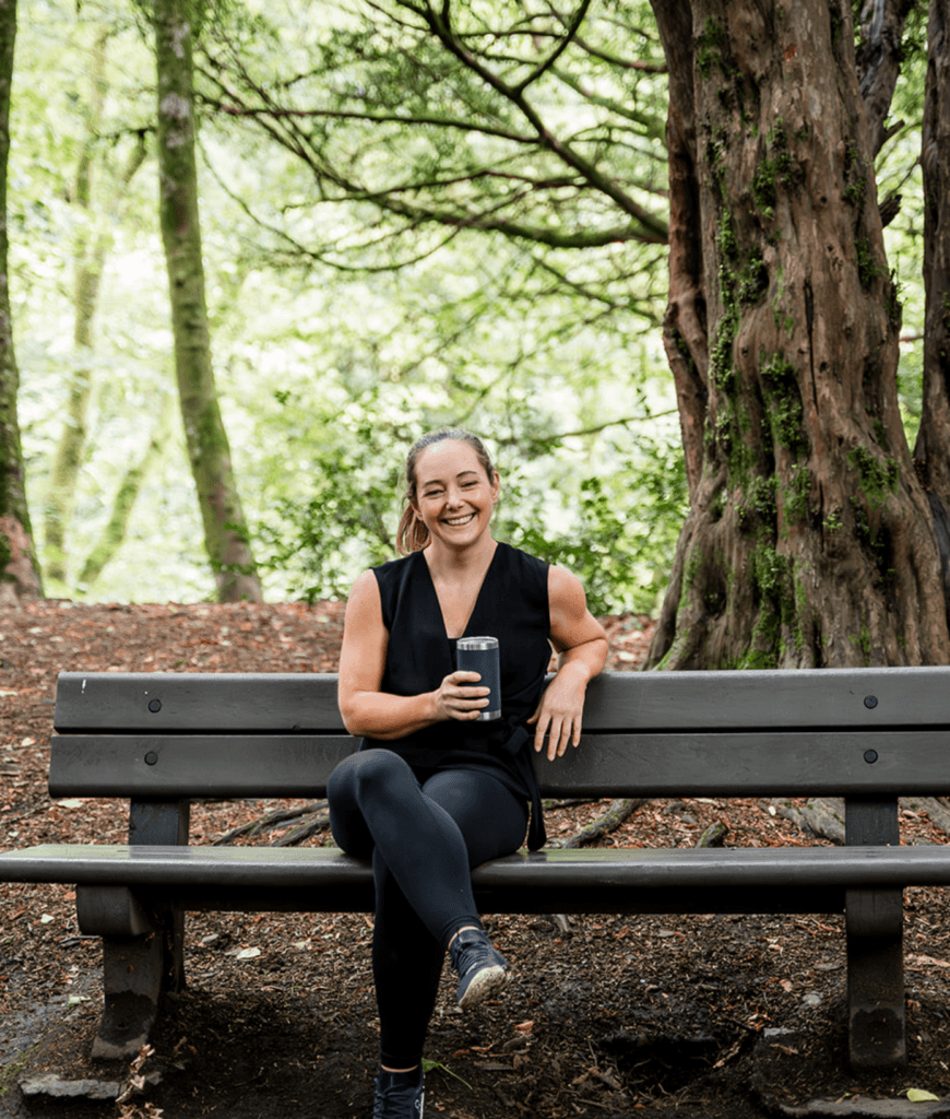 Diane Lillis, personal trainer from Move With Diane, seated on a bench, smiling