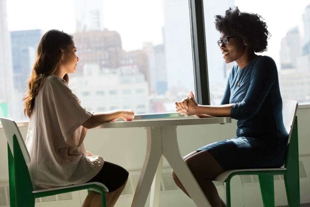 Anxious mum seeking help, talking with a health coach