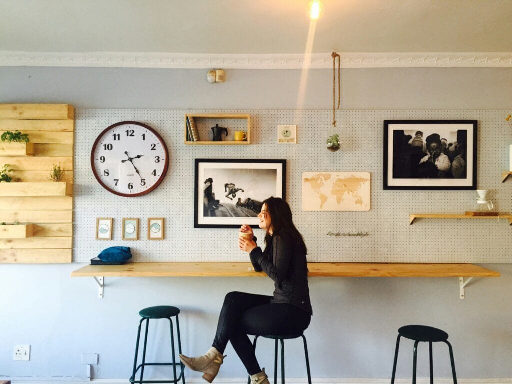 A woman at a coffee shop, having a break